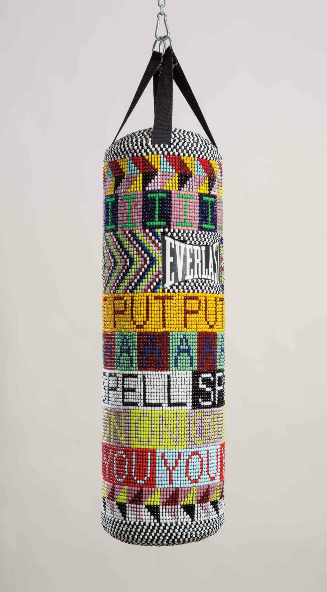 Jeffrey Gibson (Mississippi Band Choctaw/ Cherokee), I PUT A SPELL ON YOU, 2015. Repurposed punching bag, glass beads, artificial sinew, and steel; 40 × 14 × 14 in. Collection of the Nasher Museum of Art at Duke University, Durham, North Carolina. Museum purchase, 2015.11.1. Image courtesy of Jeffrey Gibson Studio and Roberts Projects, Los Angeles, California. Photograph by Peter Mauney.