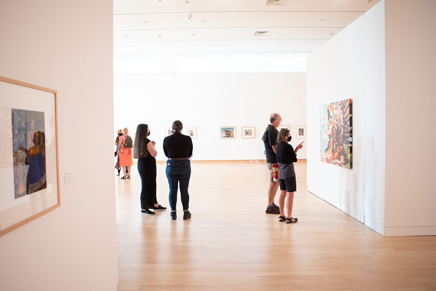 people in the main galleries looking at artwork