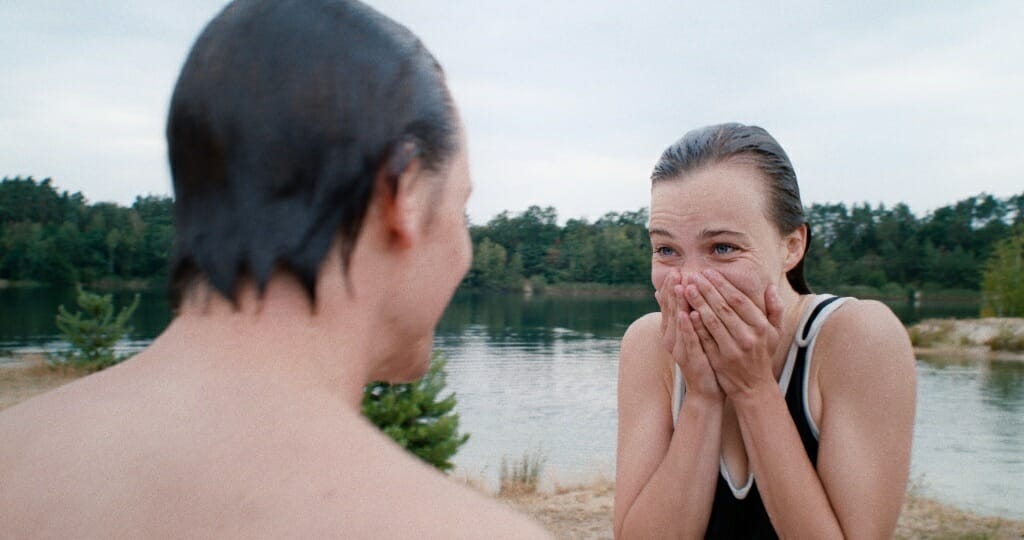 film still showing two people looking at each other