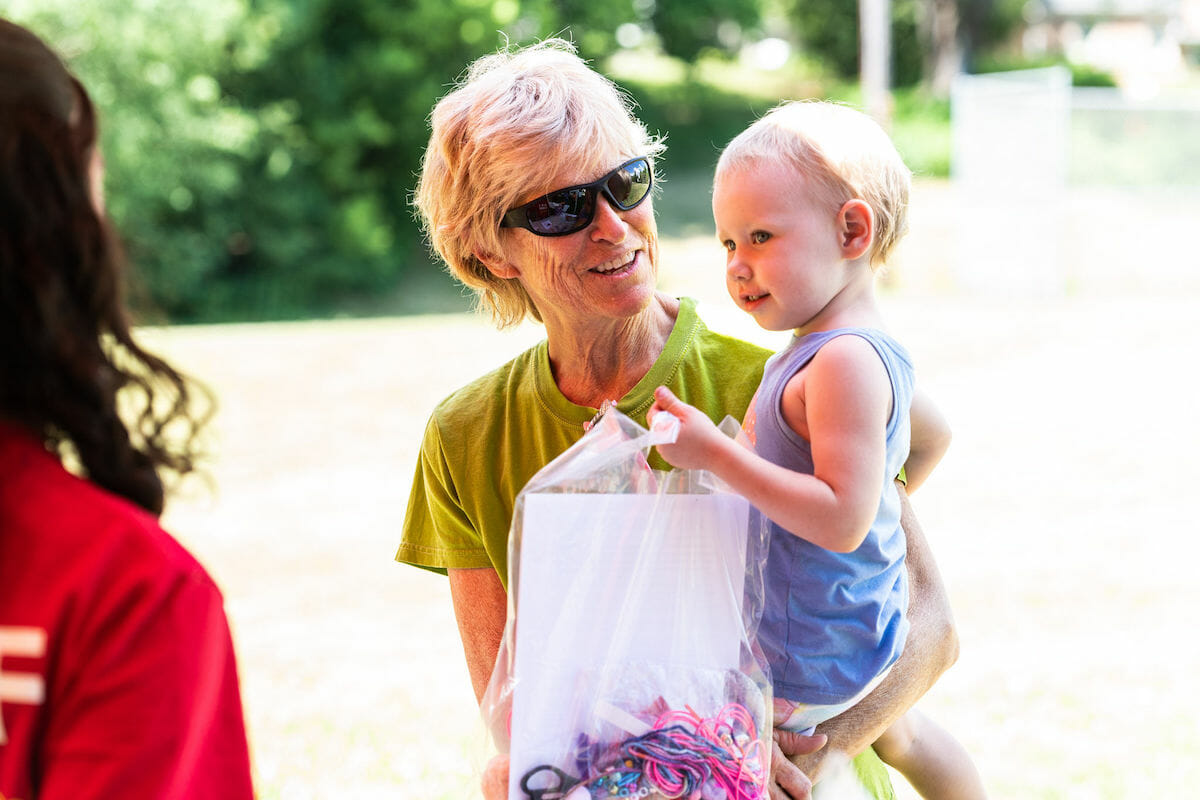 grandparent holding a baby