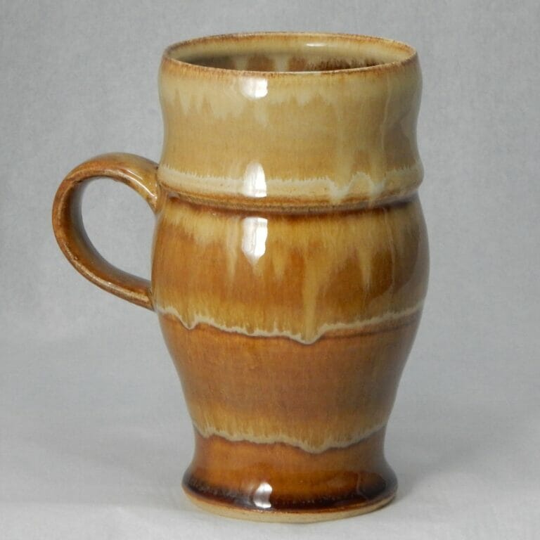 tall ceramic vase or mug with a smaller rounder handle