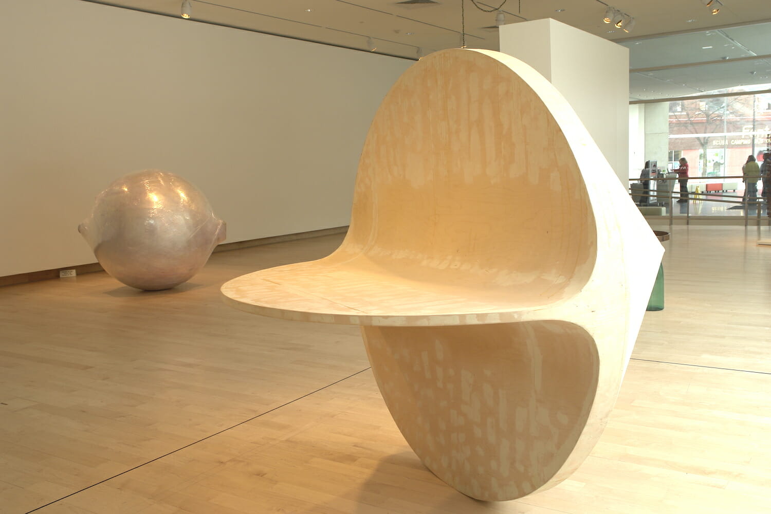 installation view of the exhibition Altered Geometry, featuring two round abstract sculptures