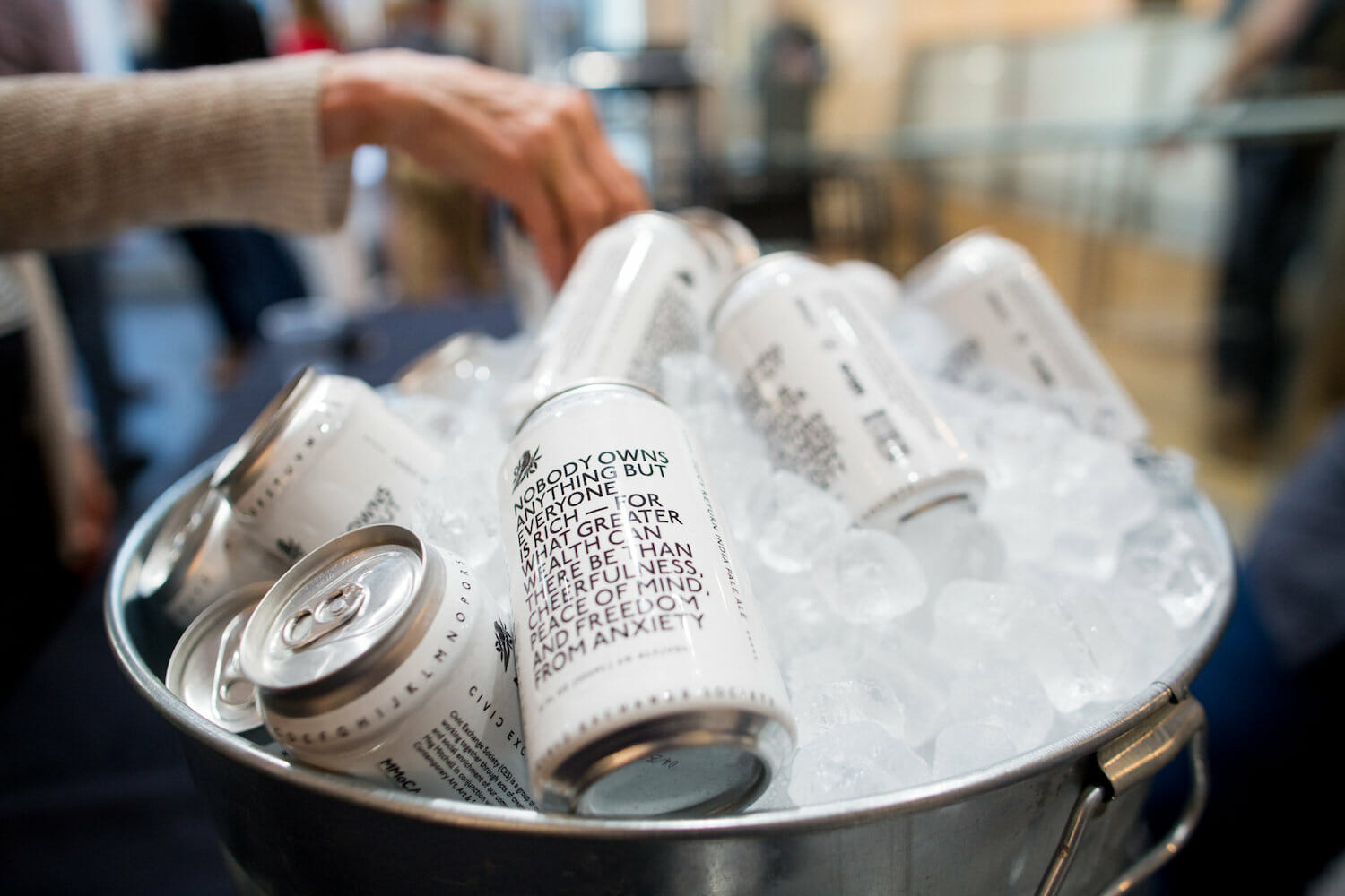 a bowl full of beer cans chilling in ice