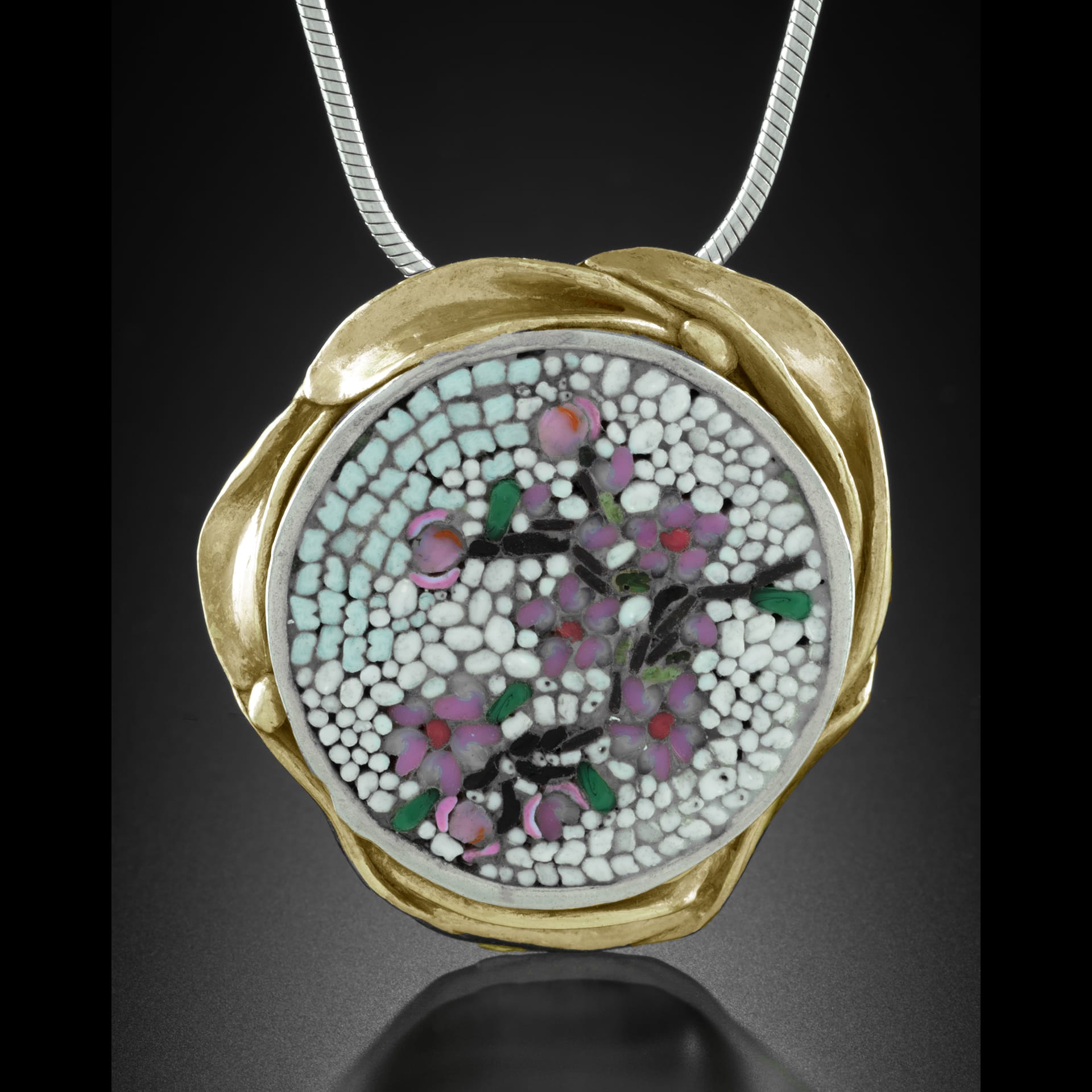 pink botanical mosaic pendant surrounded by gold.