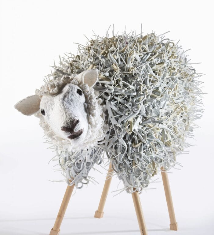 Sheep sculpture made out of scissors.