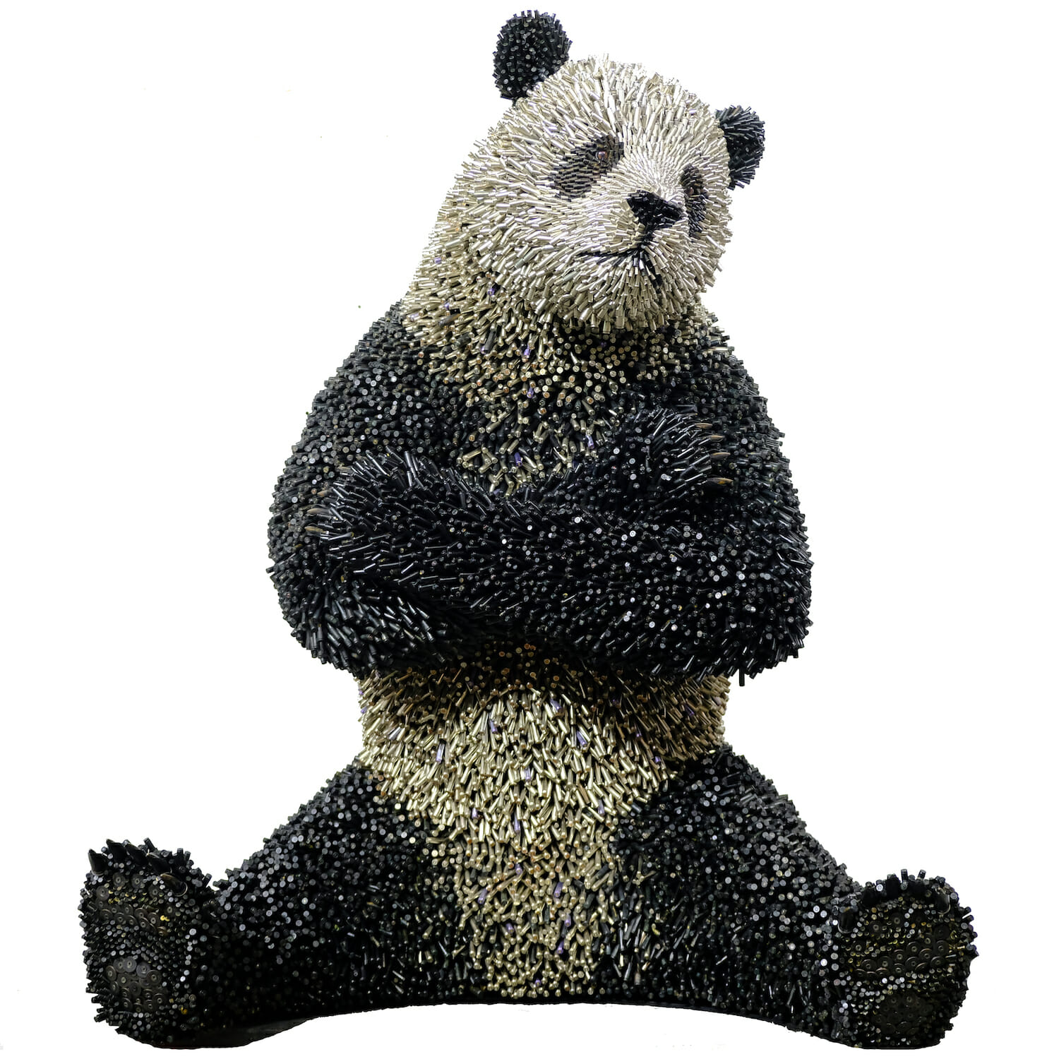 Panda bear sculpture made of bullet shells.